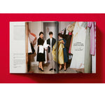 Open book view of taschen valentino book on red background.