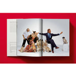Open book view of taschen valentino book on red background.