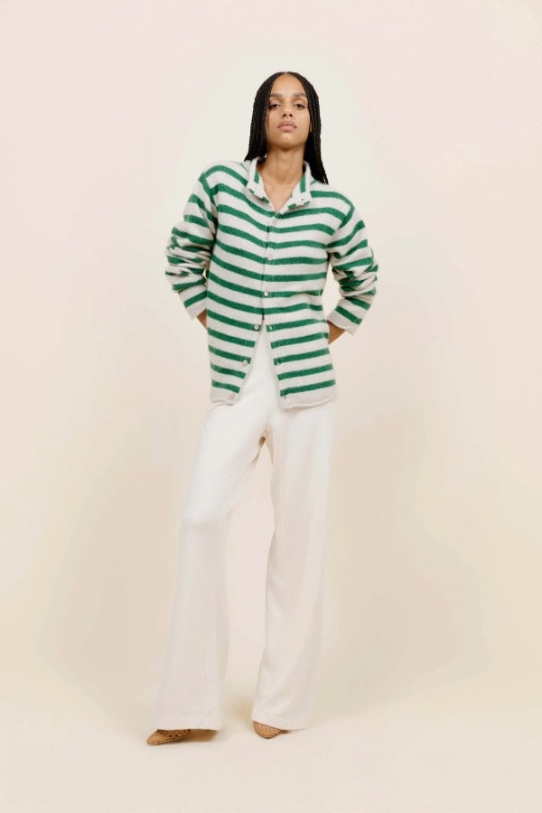 Front view of fern/white costeau stripe cardigan on model wearing white pants and heels, against a white background.
