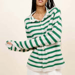 Alternate front view of fern/white costeau stripe cardigan on model wearing white pants, against a white background.