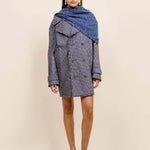 Front view of storm marl triangle body scarf on model wearing blue coat and flats, against a white background.