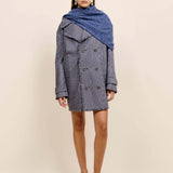 Front view of storm marl triangle body scarf on model wearing blue coat and flats, against a white background.