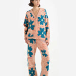 Front view of multi floral the elder statesman sun and moon cardigan on model wearing matching pants and heels, against a white background.