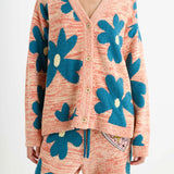 Front closeup view of multi floral the elder statesman sun and moon cardigan on model wearing matching pants, against white background