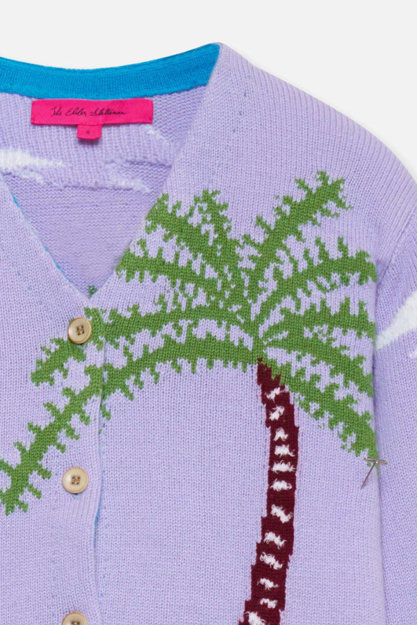 Front closeup view of multi palm beach cardigan laying on flat surface, against a white background.