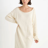 Front closeup view of natural nora lite oversized dress on dark-haired model, against a white background.