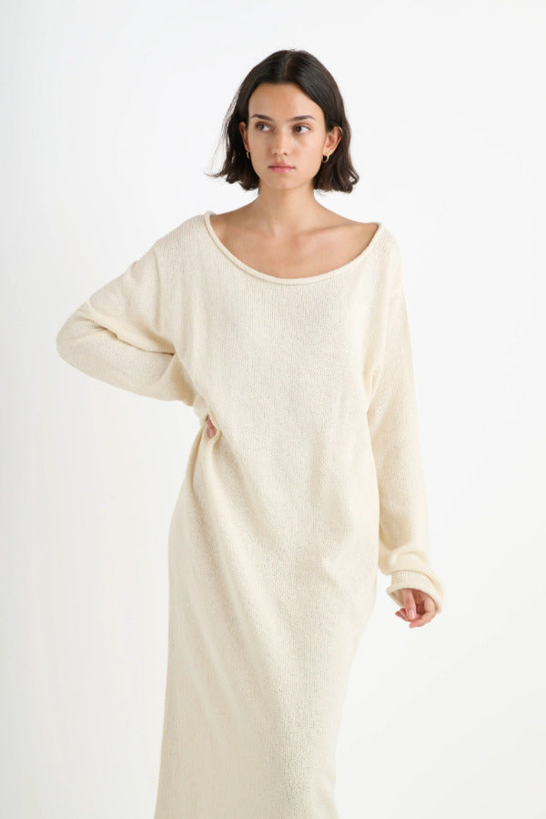 Front closeup view of natural nora lite oversized dress on dark-haired model, against a white background.