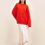 Front view of cherry pali crew on model wearing white slip and platforms, against a white background.