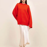 Front view of cherry pali crew on model wearing white slip and platforms, against a white background.