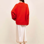 Back view of cherry pali crew on model wearing white slip and platforms, against a white background.