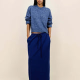 Front view of storm zuma marl crew on model wearing blue skirt and heels, against a white background.