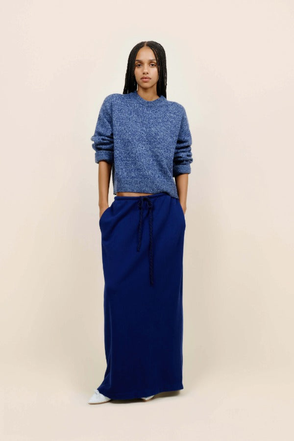 Front view of storm zuma marl crew on model wearing blue skirt and heels, against a white background.
