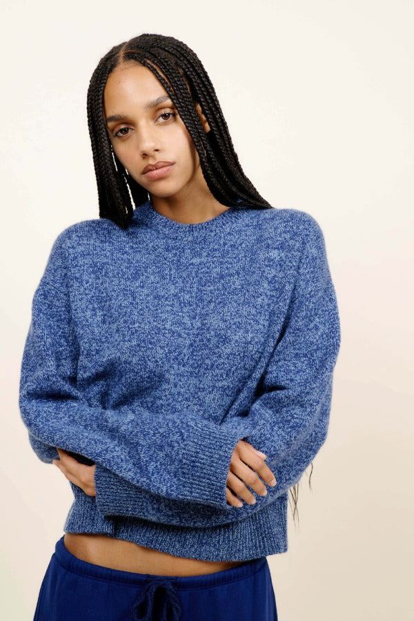 Front closeup view of storm zuma marl crew on model wearing blue skirt, against a white background.