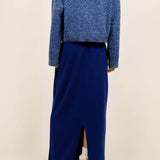 Back view of storm zuma marl crew on model wearing blue skirt and heels, against a white background.