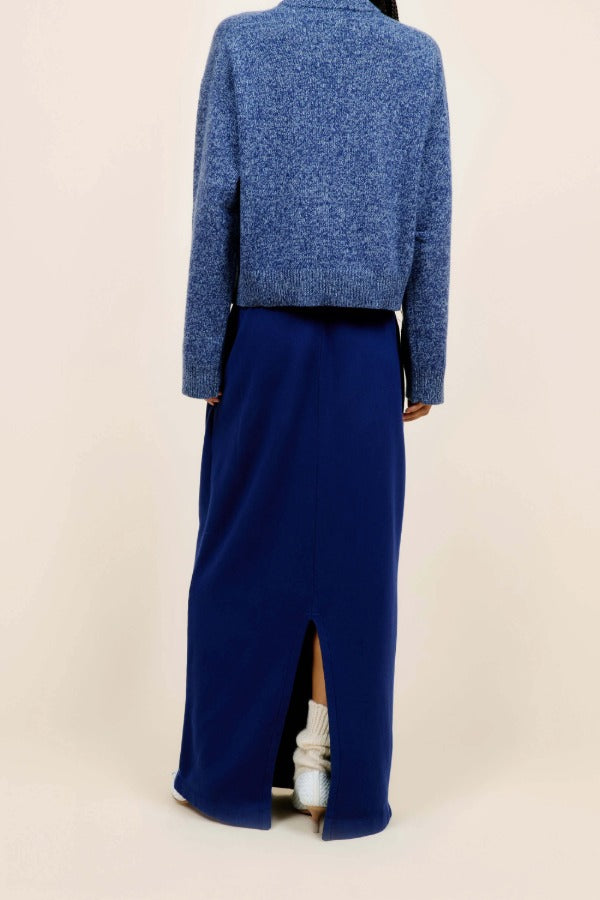 Back view of storm zuma marl crew on model wearing blue skirt and heels, against a white background.