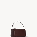Front slanted view of burgundy 90's bag on white background, with no model shown.
