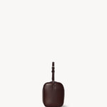 Side view of burgundy 90's bag on white background, with no model shown.