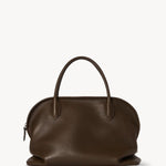 Front view of deep brown agnes bag on white background, with no model shown.