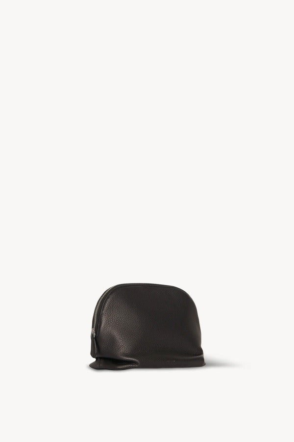 Back view of dark brown agnes pouch on white background, with no model shown.