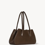 Front slanted view of deep brown alger shoulder bag on white background, with no model shown.