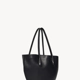 Side slanted view of black alger tote on white background, with no model shown.