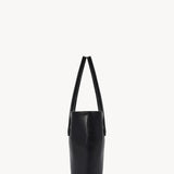 Side view of black alger tote on white background, with no model shown.