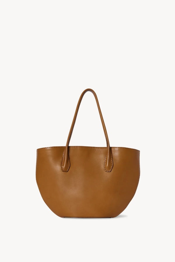 Front view of cuir alger tote on white background, with no model shown.