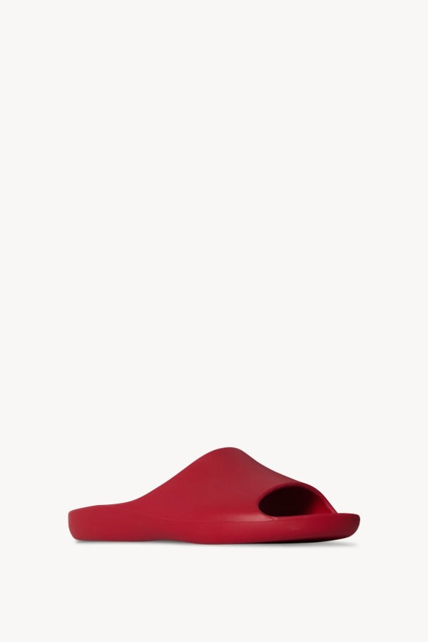 Right side slanted view of red ama slide on white background, with no model shown.