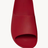 Overhead view of red ama slide on white background, with no model shown.