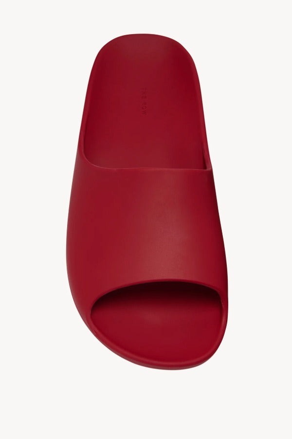 Overhead view of red ama slide on white background, with no model shown.