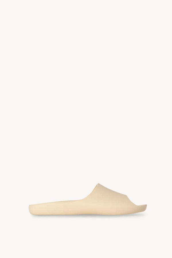 Right side view of toile ama slide on white background, with no model shown.