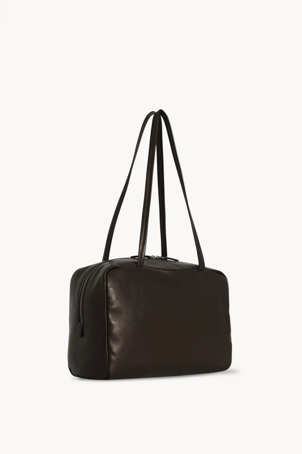 Front slanted view of dark brown astra bowling bag on white background, with no model shown.