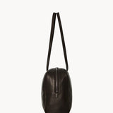 Side view of dark brown astra bowling bag on white background, with no model shown.