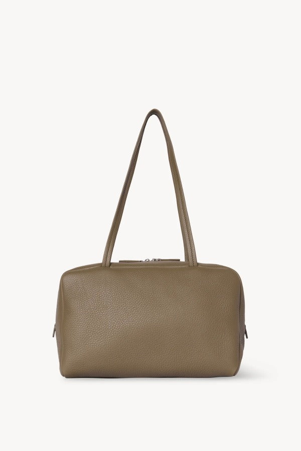 Front view of smoked taupe astra bowling bag on white background, with no model shown.