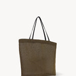 Side slanted view of a mesh and leather blue bag pictured on a white background, with no model shown.