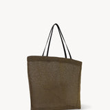 Side slanted view of a mesh and leather blue bag pictured on a white background, with no model shown.
