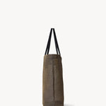 Side view of a mesh and leather blue bag pictured on a white background, with no model shown.