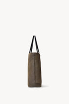 Side view of a mesh and leather blue bag pictured on a white background, with no model shown.