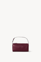 Front view of a purple leather bag on a white background, with no model shown.