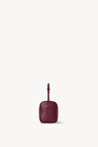 Side view of a purple leather bag on a white background, with no model shown.