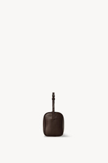 Side view of a brown melange leather bag on white background, with no model shown.