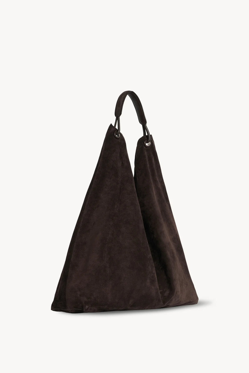 Side slanted view of the brown melange suede bag on white background, with no model shown.