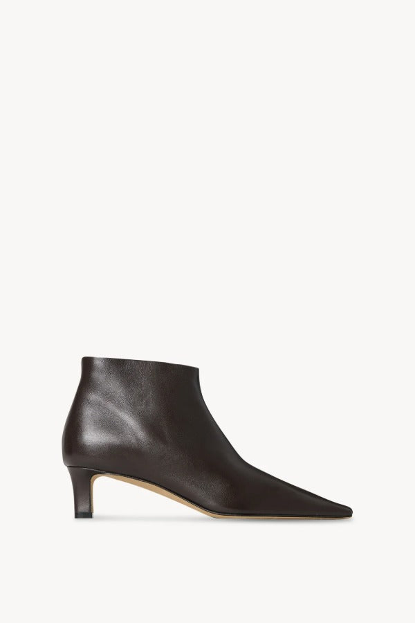 Right side view of lacquer brown carla boot on white background, with no model shown.