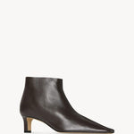 Front slanted view of lacquer brown carla boot on white background, with no model shown.