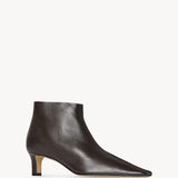 Front slanted view of lacquer brown carla boot on white background, with no model shown.