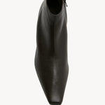 Overhead view of lacquer brown boot on white background, with no model shown.