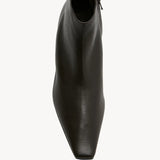 Overhead view of lacquer brown boot on white background, with no model shown.