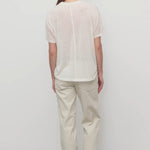 Back view of ice carlyl pant on model wearing white t-shirt and sneakers, against a white background.