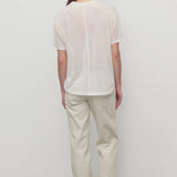 Back view of ice carlyl pant on model wearing white t-shirt and sneakers, against a white background.