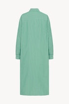 The image displays the back view of a long-sleeved midi dress. It is a button-down style, crafted from green and white cotton. The dress is presented on a plain white background.